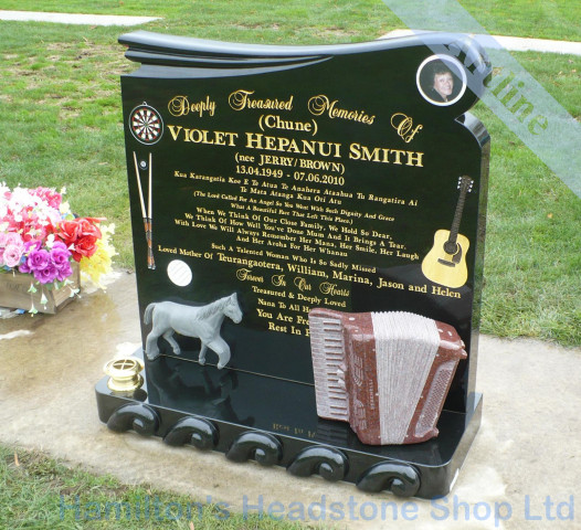 carved accordian  memorial headstone