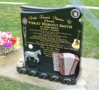 carved accordian  memorial headstone